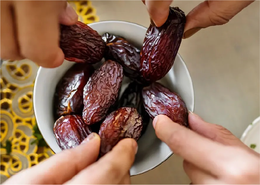 Fresh dates on palm tree
